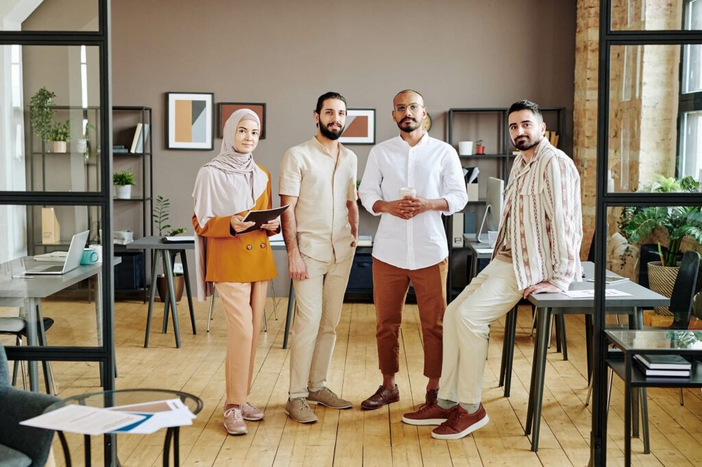 group-of-four-young-successful-employees-in-casual
